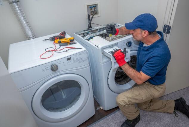 repair technician conducting refrigerator diagnostic and repair in Congers