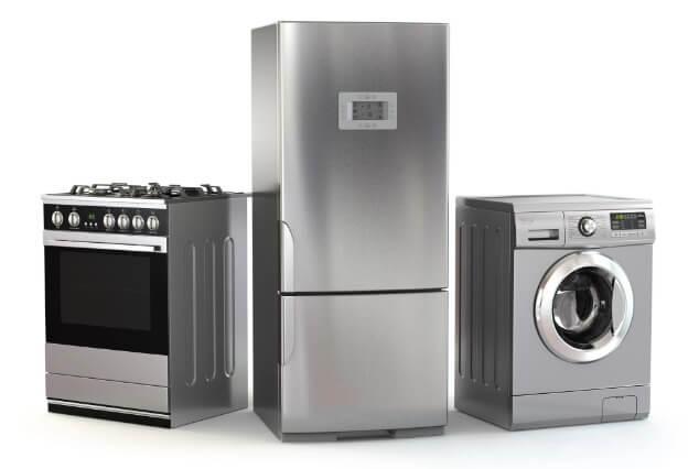 a technician examining a malfunctioning washing machine